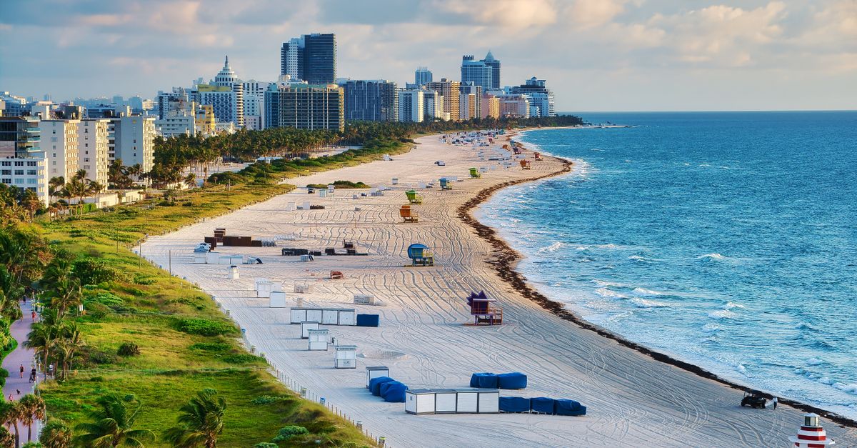 Aerial photo of Miami Beach with skyline and ocean, showcasing a vibrant summer cityscape.